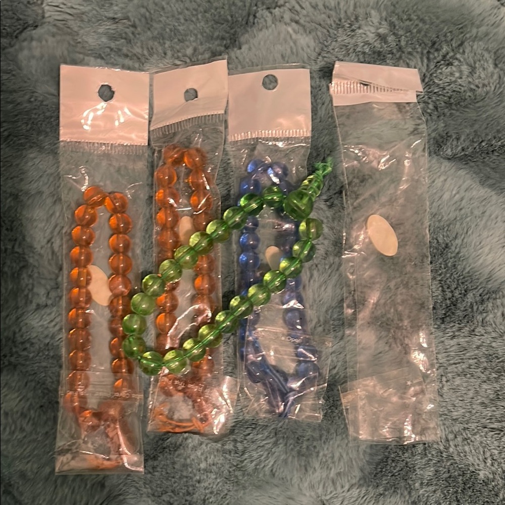 NEW-Colorful Beaded Kids Bracelets Set-x4
Green, blue, and 2 orange/brown